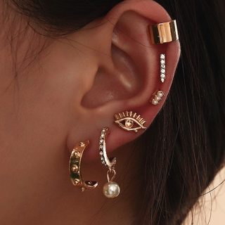 Juego de aretes geométricos y ojo