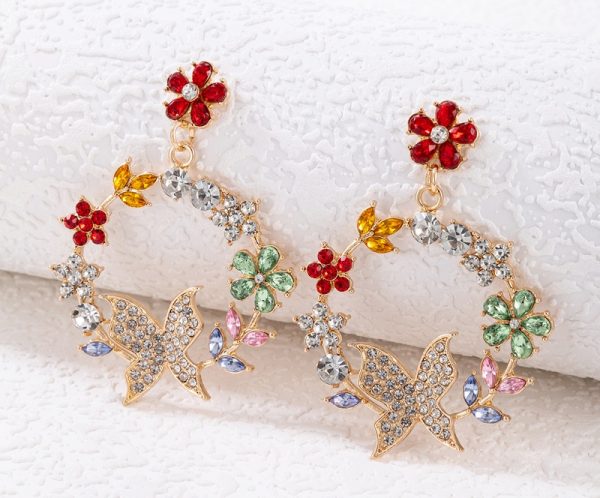 Arete flor y mariposa